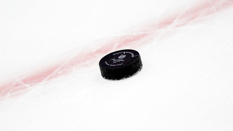 A hockey puck is seen in the third period of an NHL hockey game between the Philadelphia...