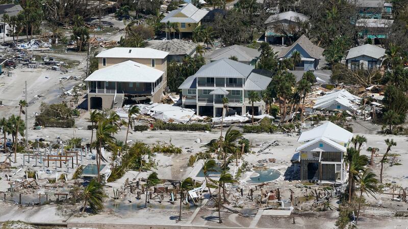 FILE - Damaged and missing homes are seen in the wake of Hurricane Ian, Sept. 29, 2022, in...
