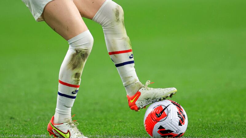 The official Nike game ball is controlled by the Nike cleats worn by United States midfielder...
